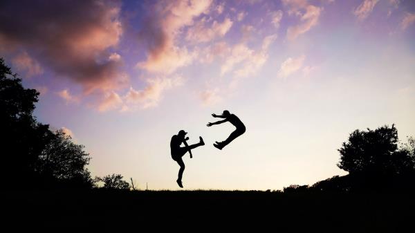 People Silhouette Jump Wallpaper