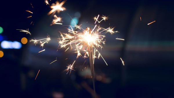 Bengal Fire Sparks Glitter Blur Dark Background wallpaper