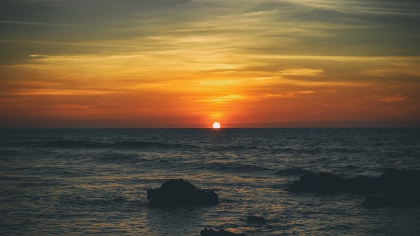Beach Sunset Sea Sunrise 4k Qa wallpaper